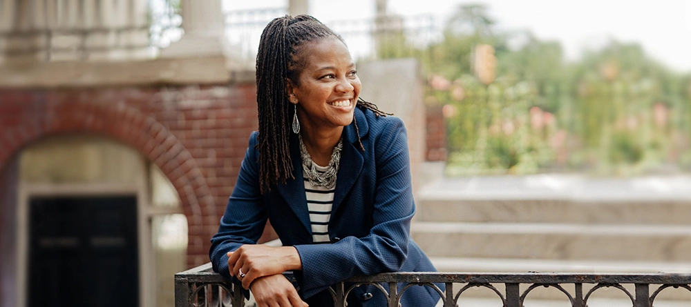 shameka smiling on trustice front porch