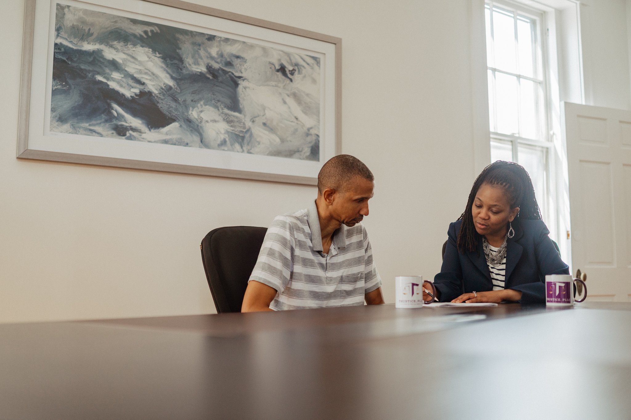 shameka and client looking over paperwork
