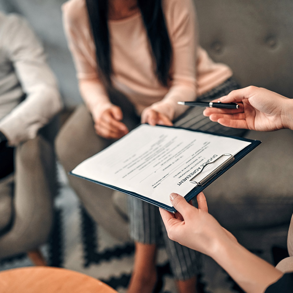 Couple signing divorce agreement